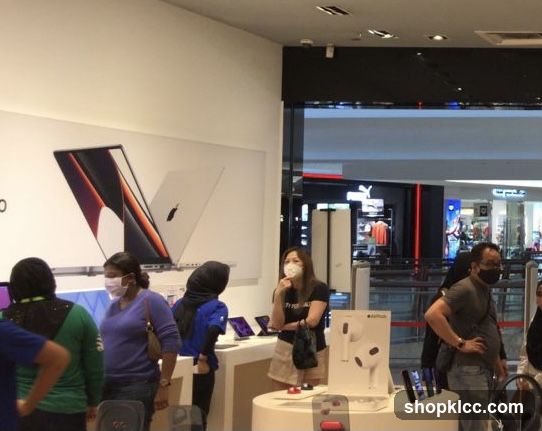 People browsing electronics store