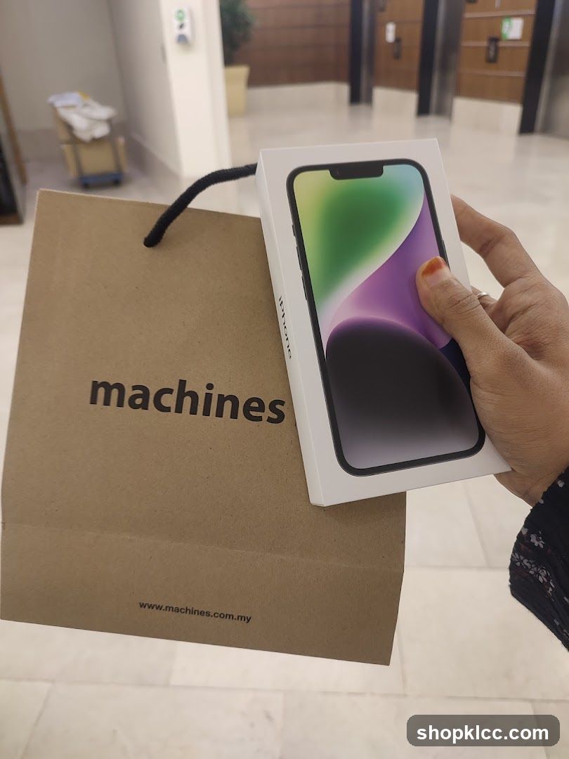 iPhone 14 Pro box and shopping bag