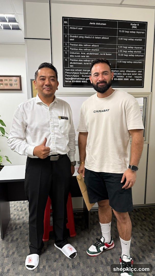 Two Men Posing in an Office