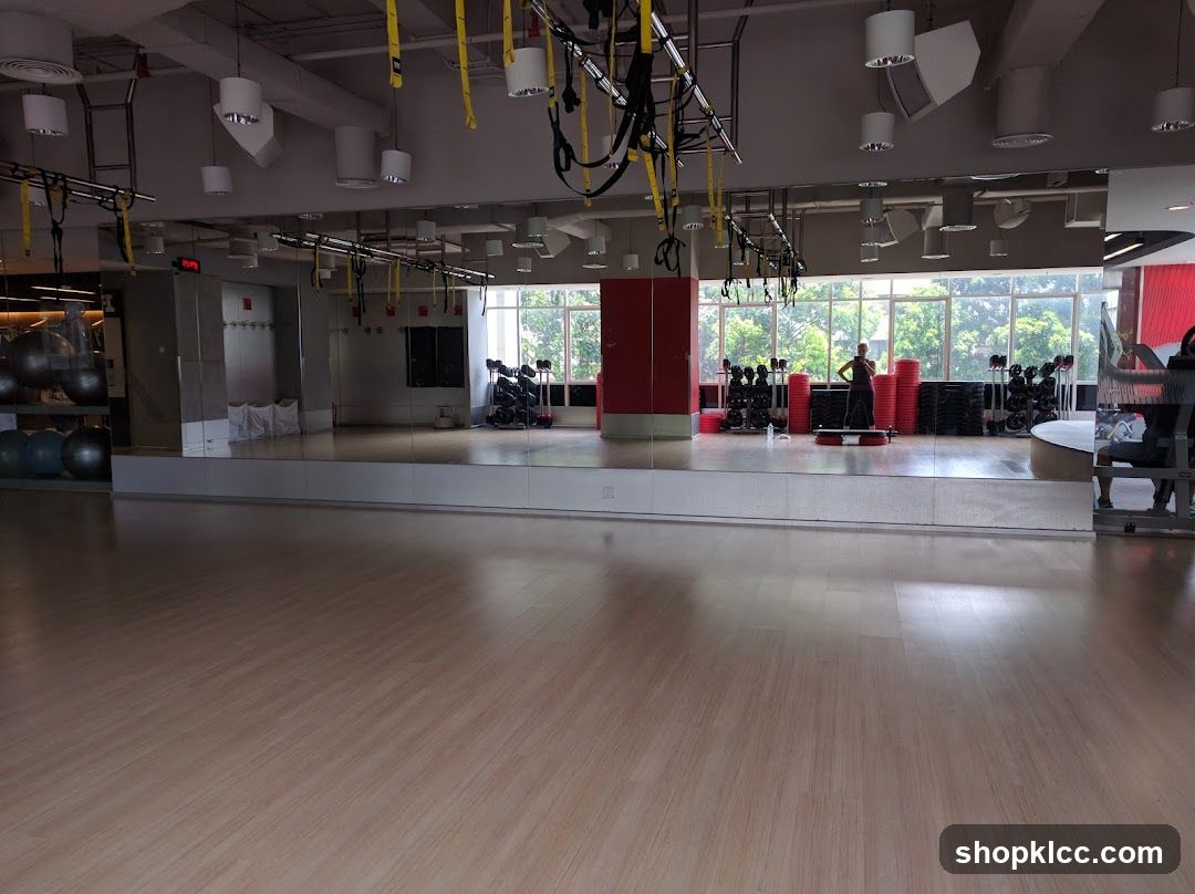 Gym Interior with Mirrored Wall and Exercise Equipment
