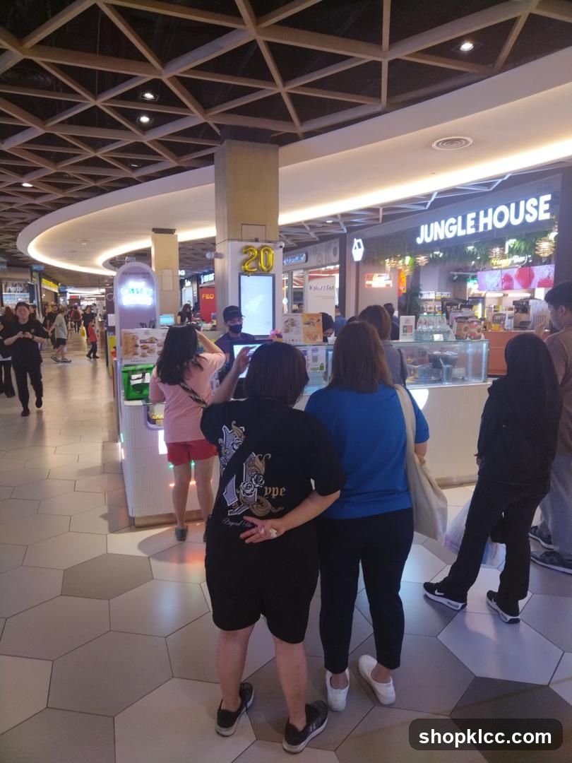 People queuing at a food stall