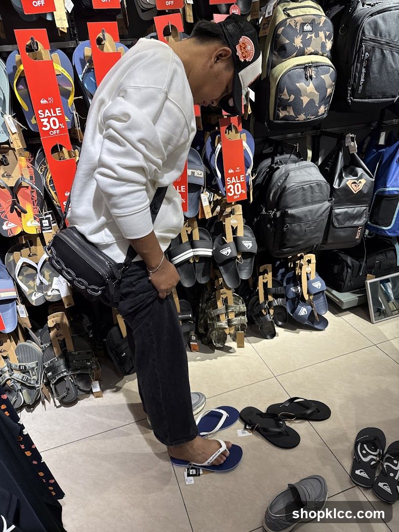 Man shopping for flip-flops