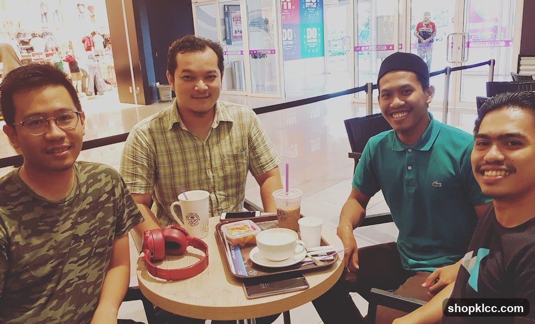 Four men at a coffee shop