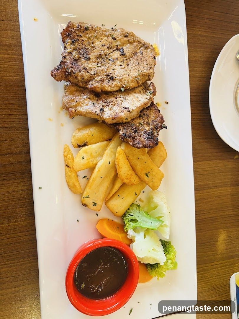 Pork Chops with Fries and Vegetables