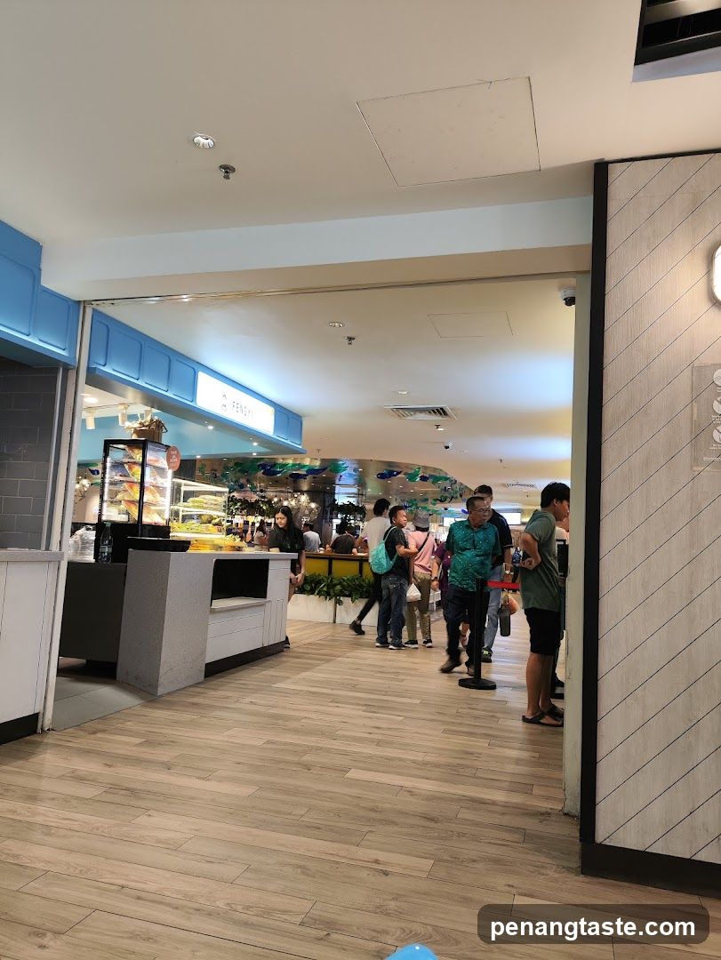 Food court entrance with people queuing