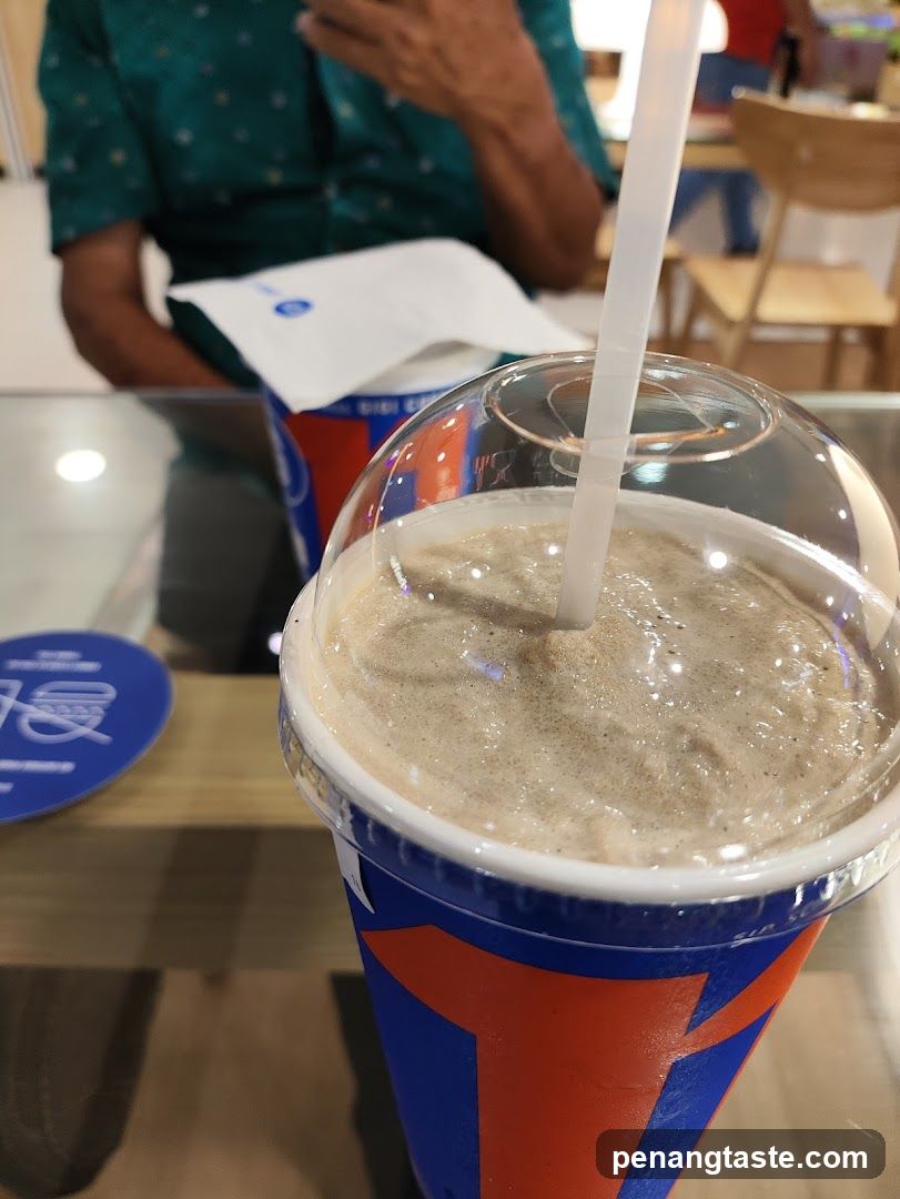 Beverage in a branded cup