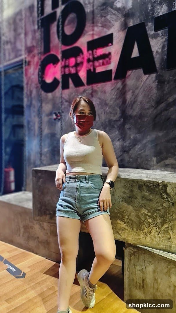 Woman posing in a modern interior space