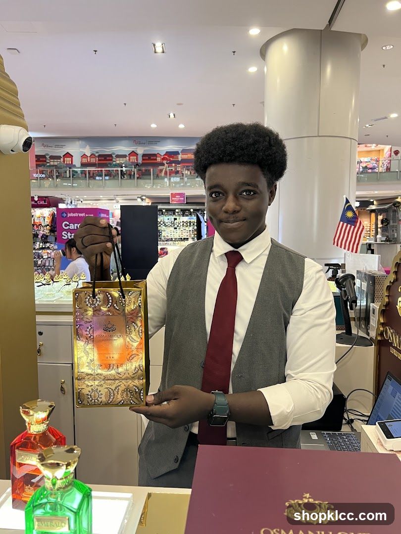 Sales Associate Holding Gift Bag