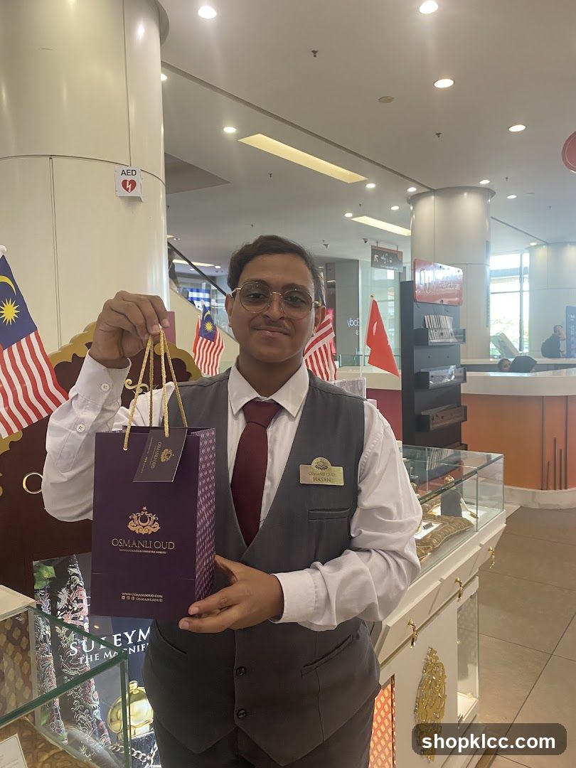 Sales Associate Holding a Shopping Bag