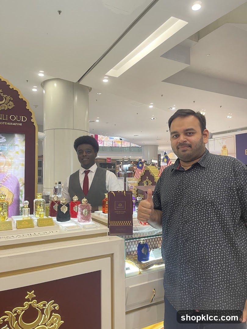 Perfume display with staff and customer