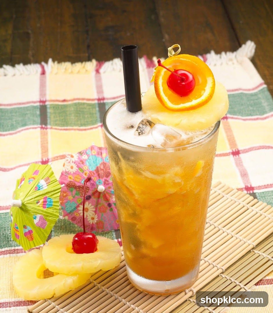 Tropical Iced Drink with Pineapple and Cherry Garnish