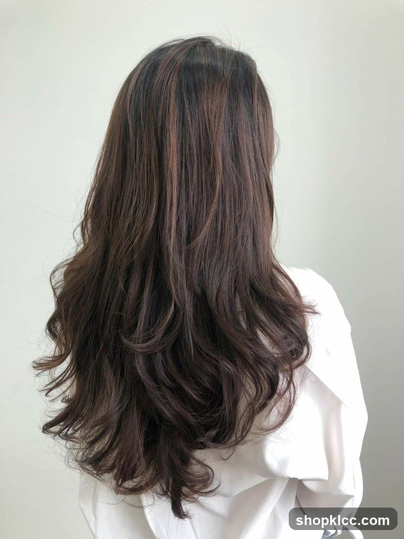Back view of a person with long wavy hair