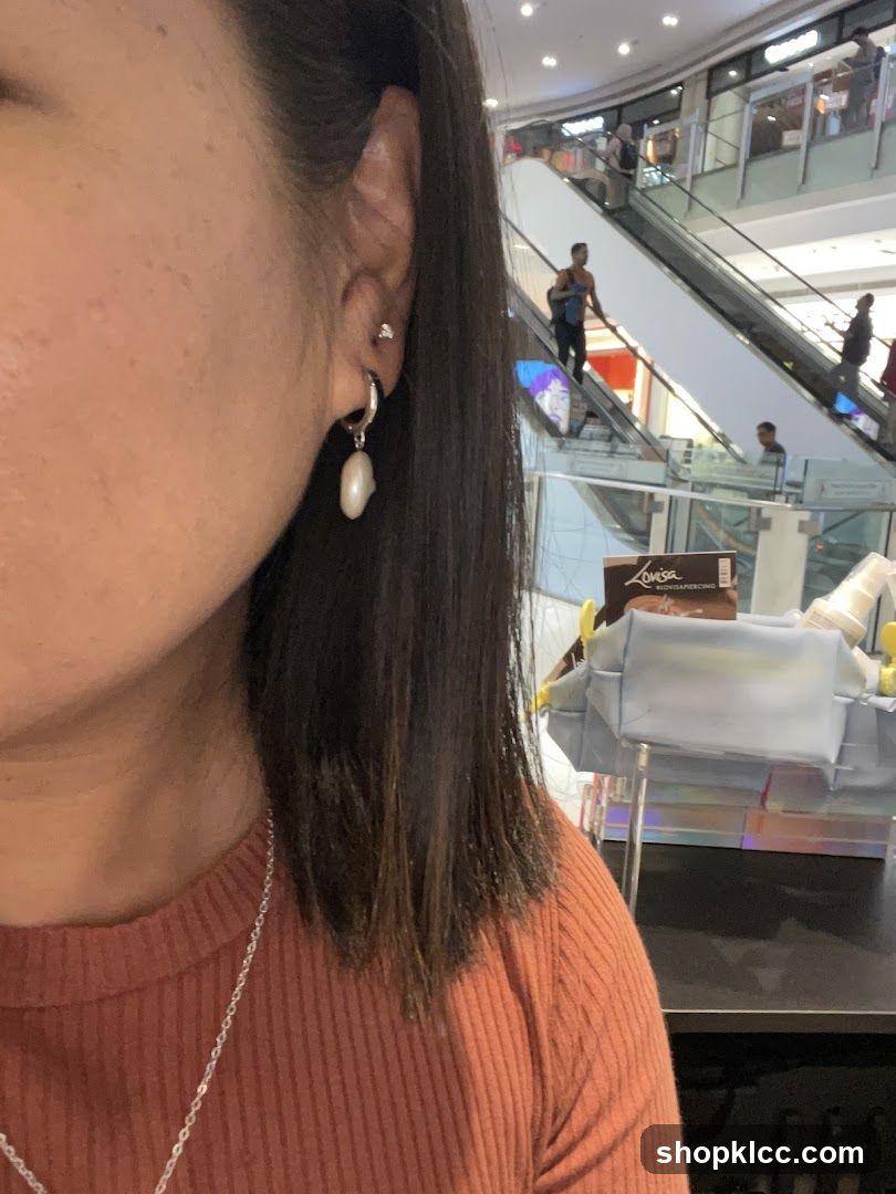 Woman wearing earrings in a mall
