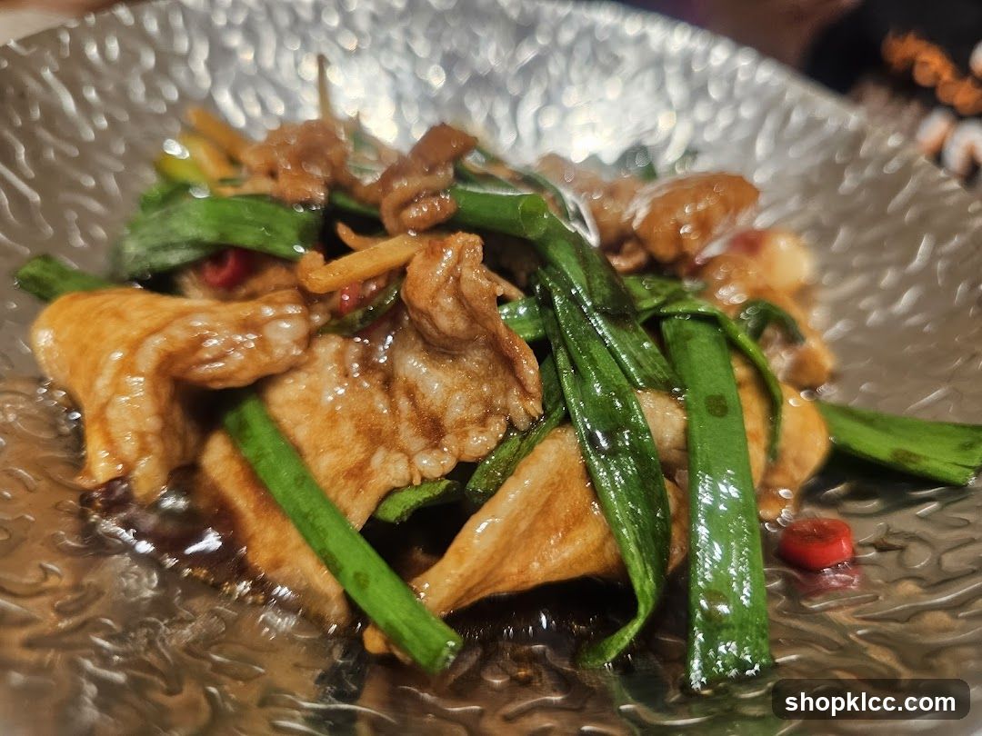 Stir-fried dish with meat and green onions