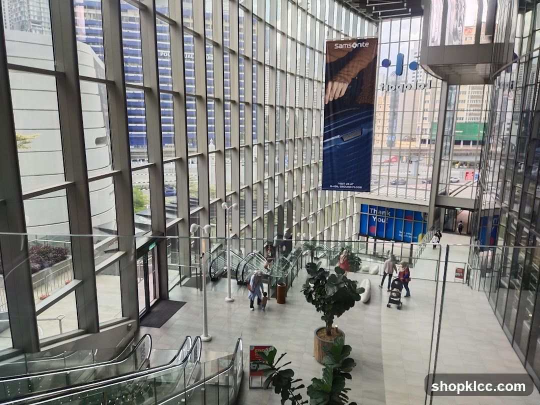 Modern atrium interior with glass facade and outdoor view