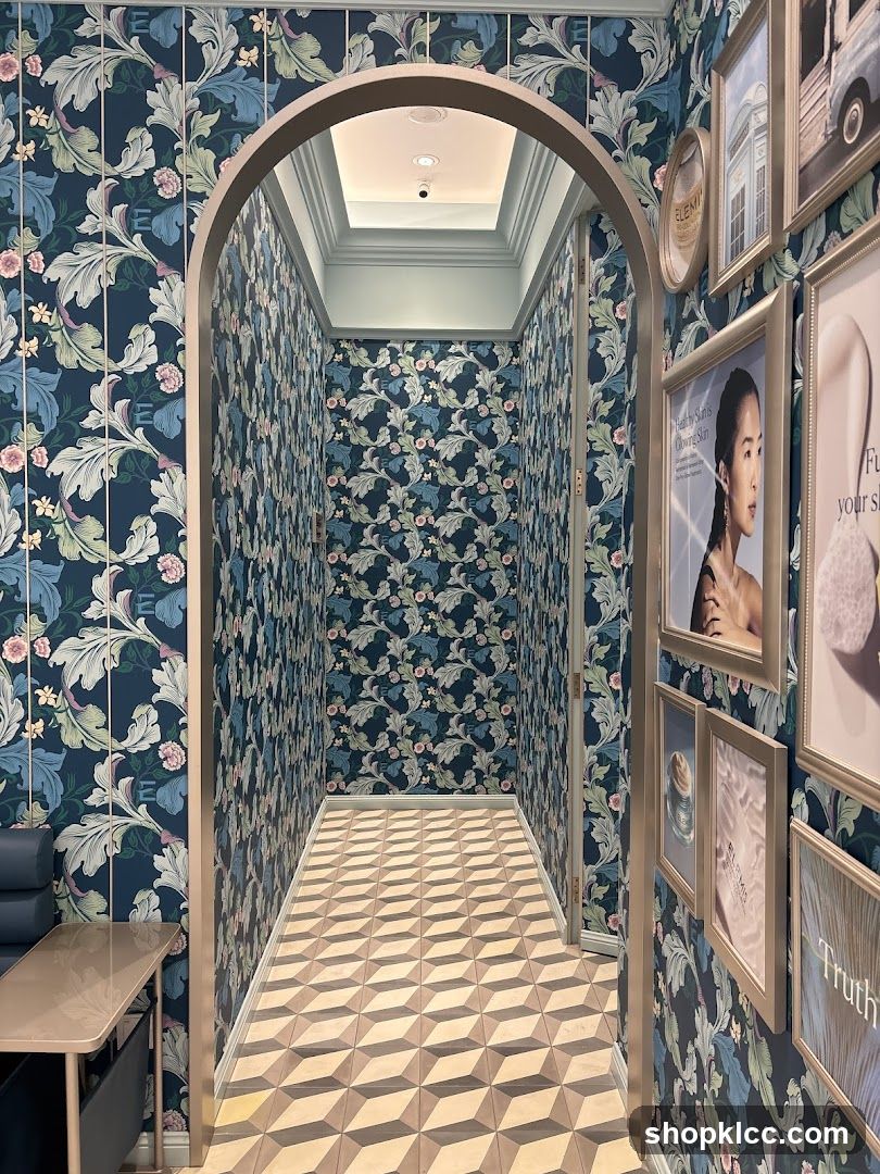 Hallway with Floral Wallpaper and Framed Art