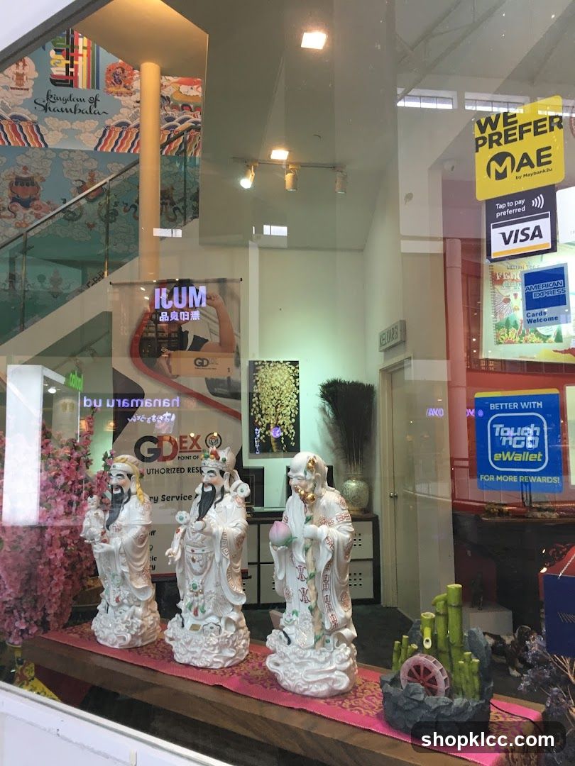 Storefront Display with Statues and Payment Logos