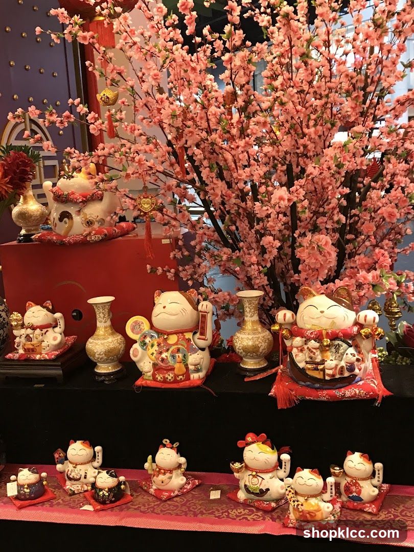 Maneki-neko Figurines and Cherry Blossoms