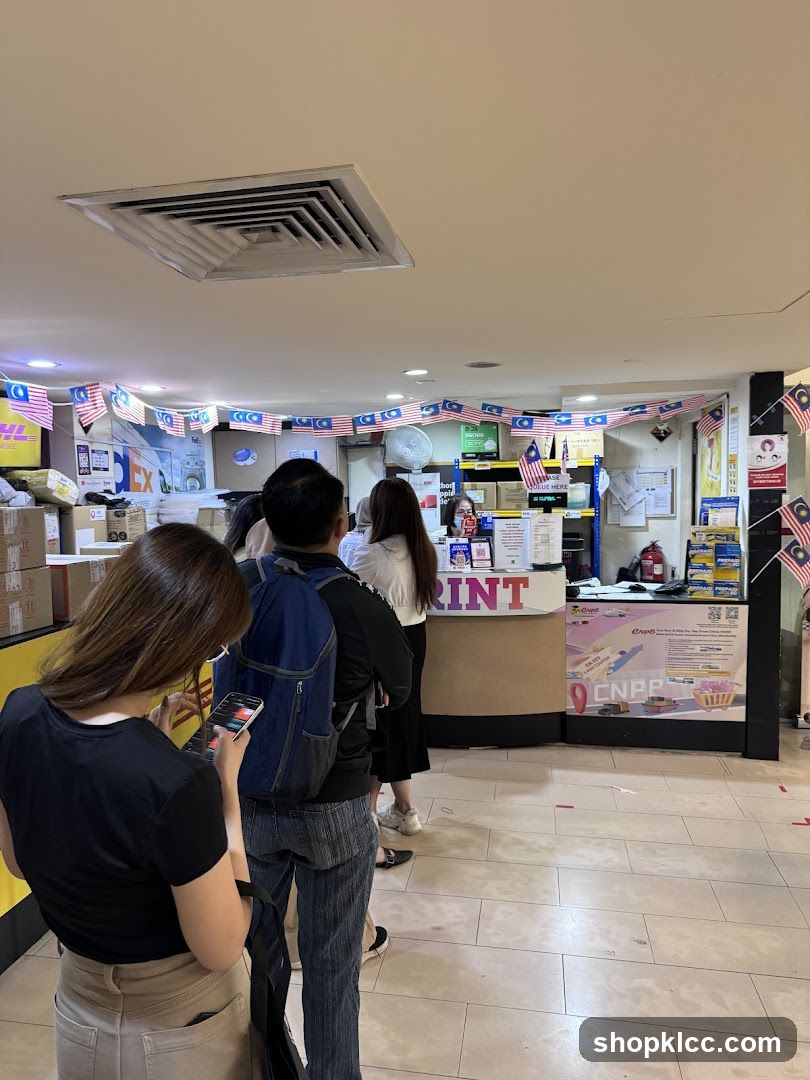 People queuing at a print and courier service counter