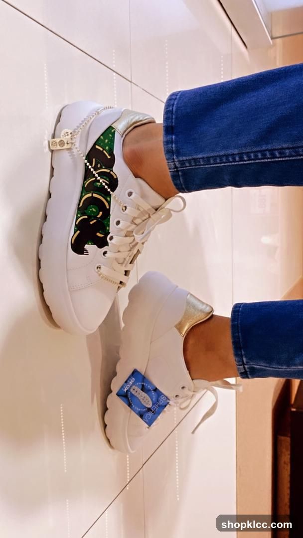 White Sneakers with Green Snake Design