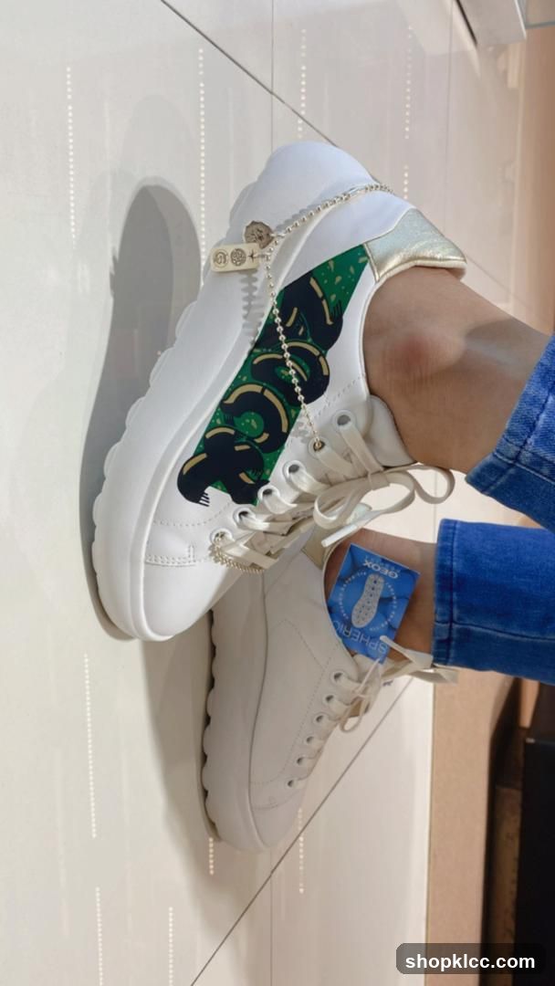 White sneakers with snake design