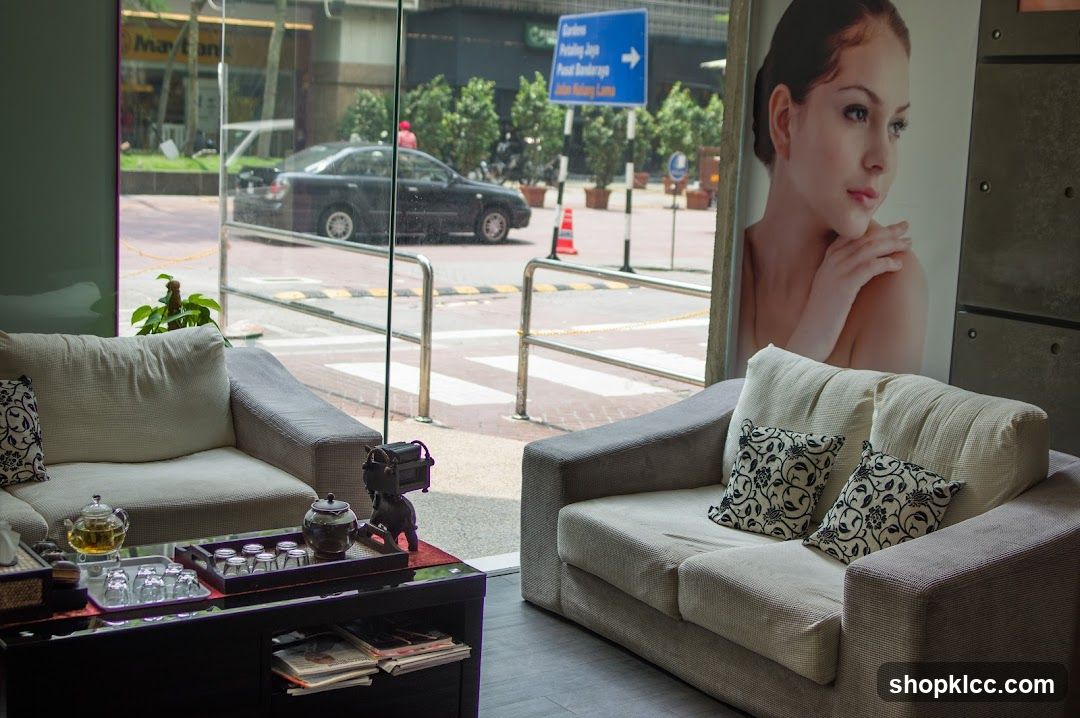 Waiting area with a large poster of a woman