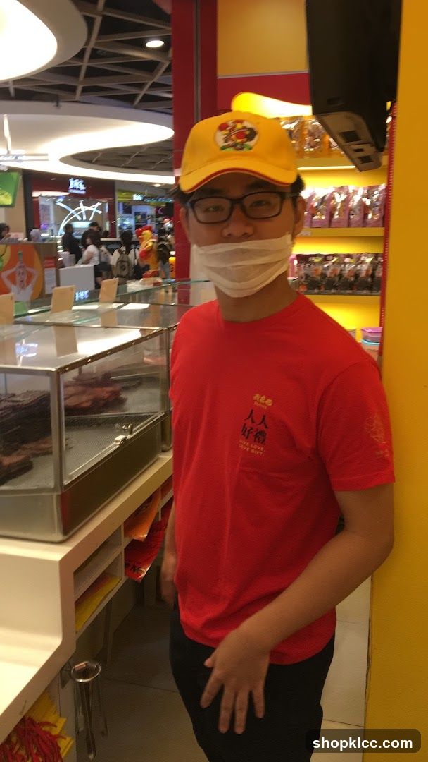 Man in Red Shirt and Yellow Cap