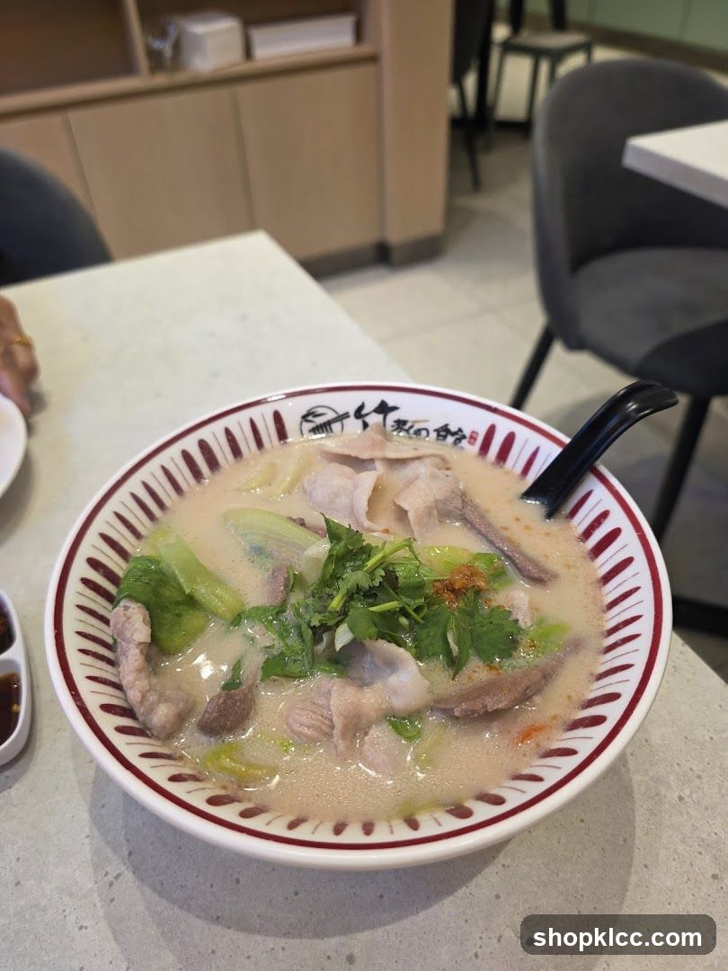 Bowl of Soup with Sliced Pork and Vegetables
