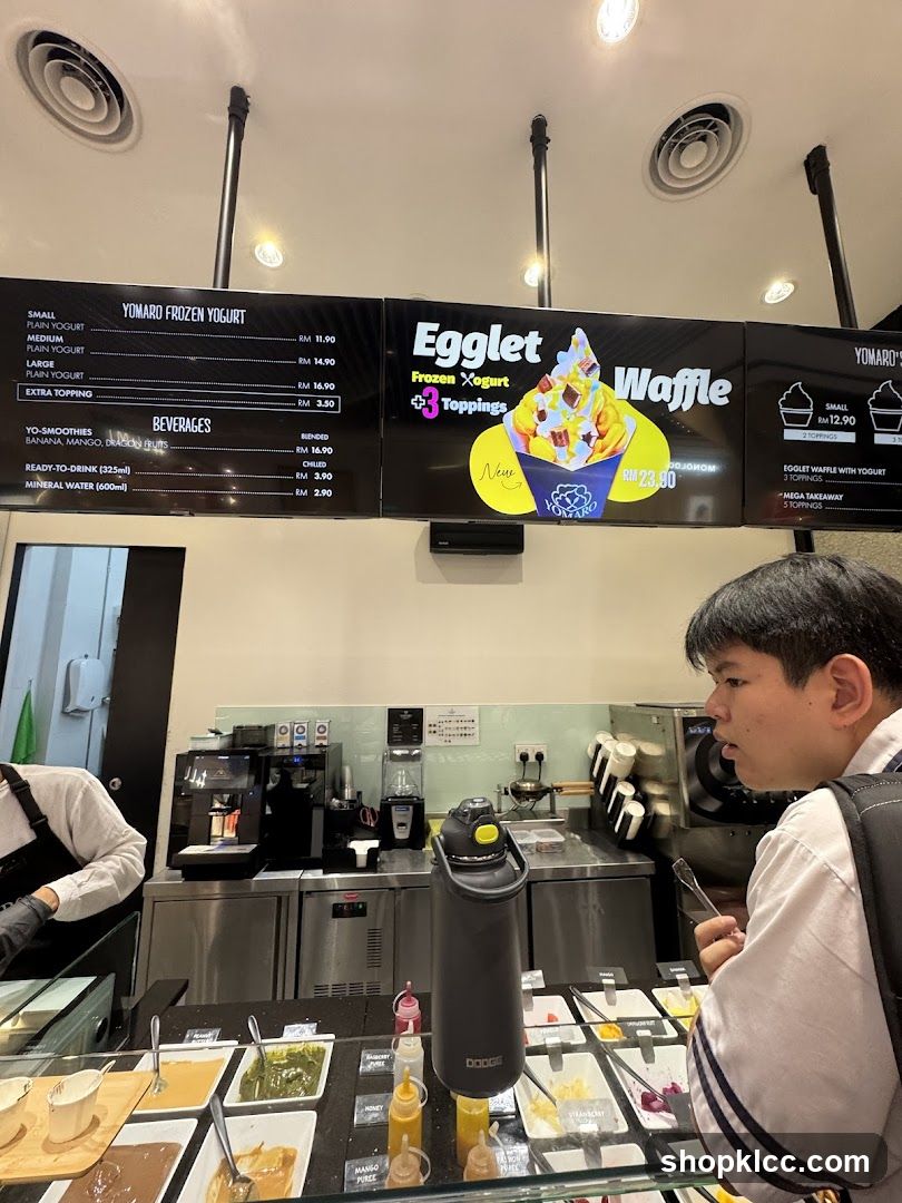 Yomaro Frozen Yogurt Menu and Toppings Display