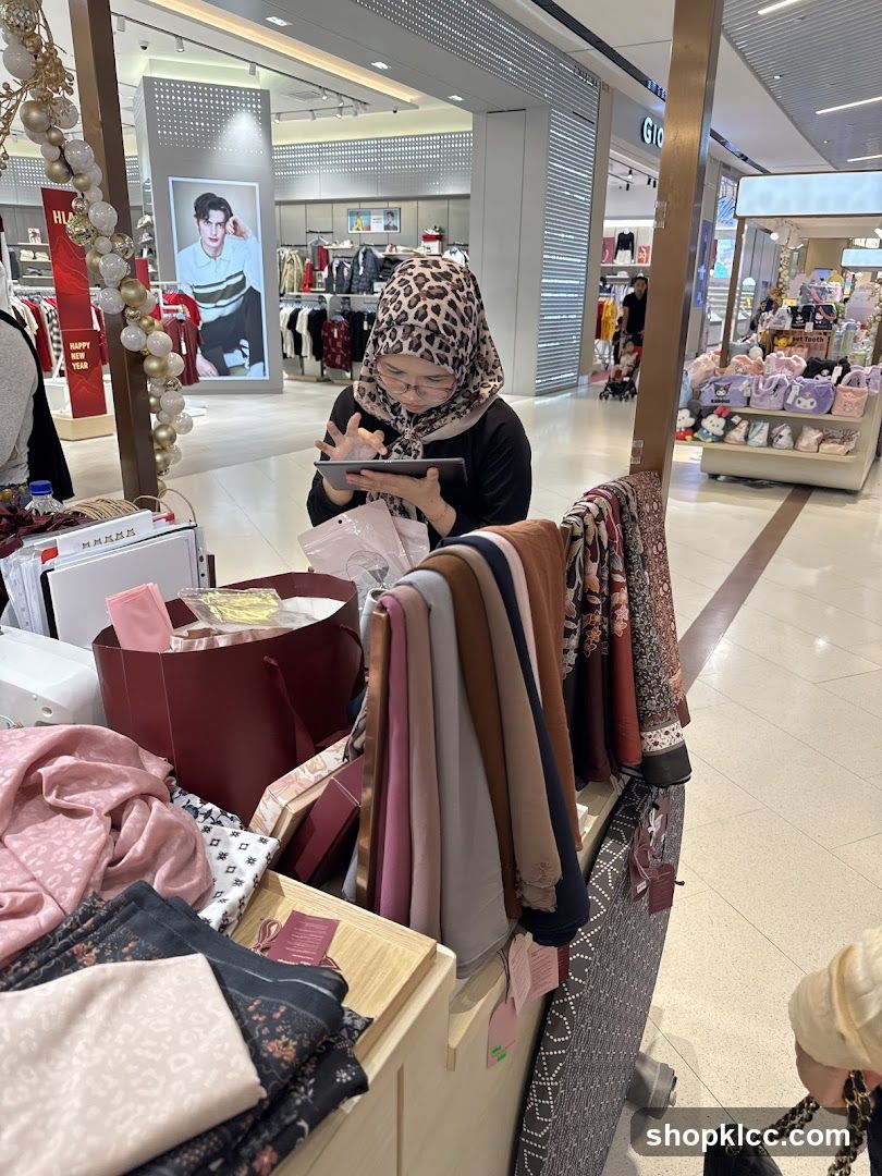 Woman using a tablet at a retail stall