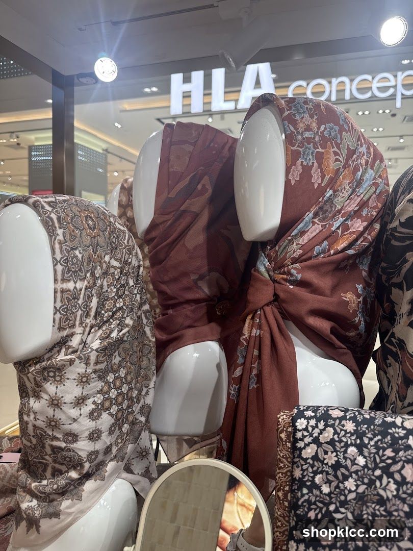 Mannequins wearing patterned scarves