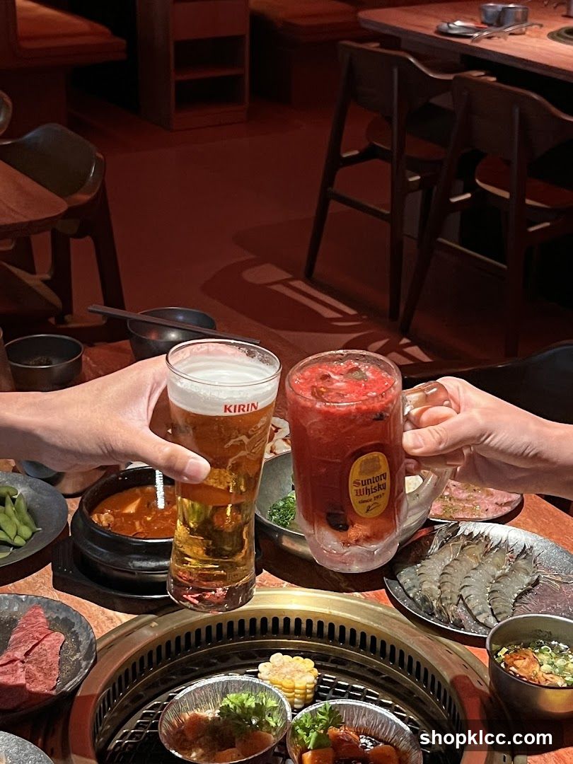 Friends toasting with drinks at a barbecue restaurant