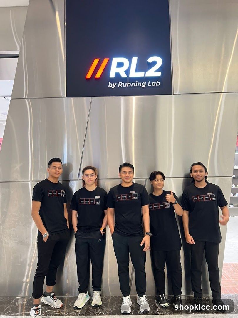 Staff Posing in Front of Store Signage