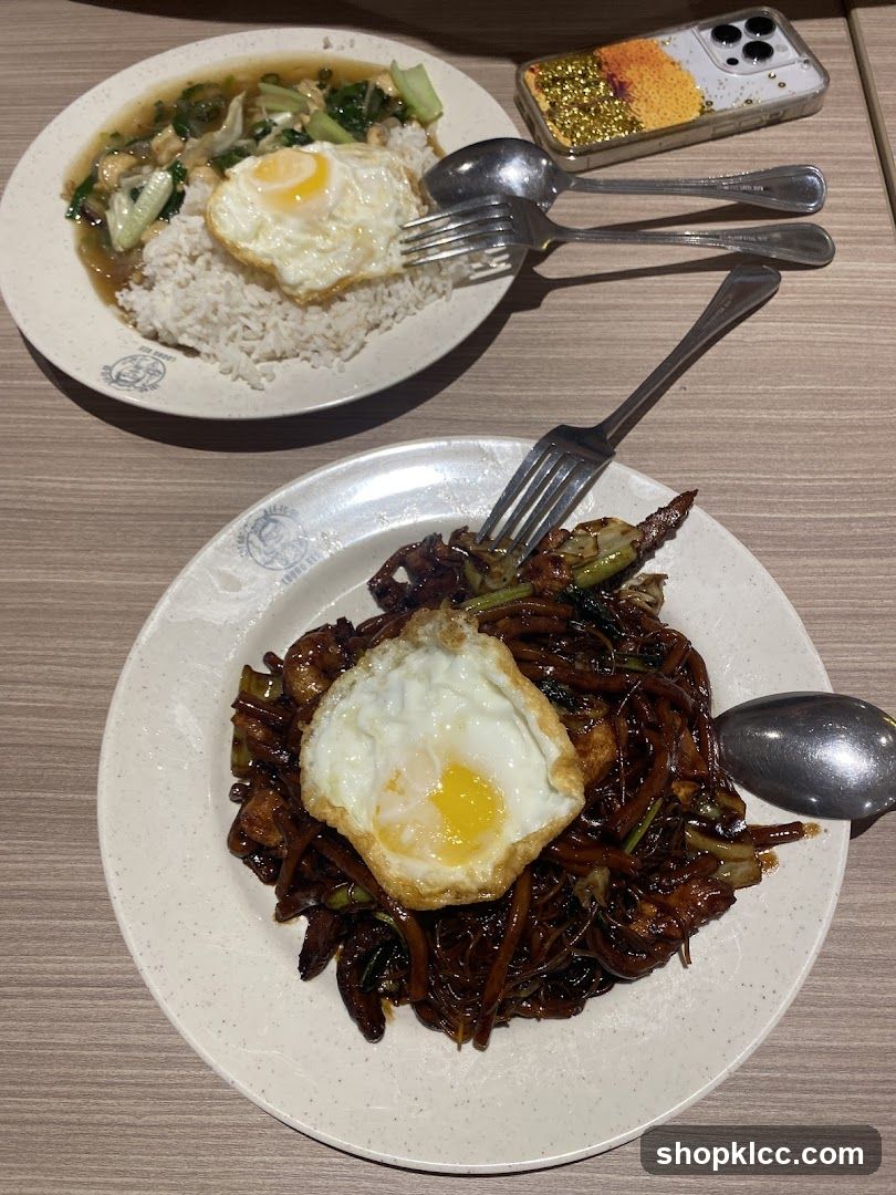 Food on table with fried egg and stir-fry