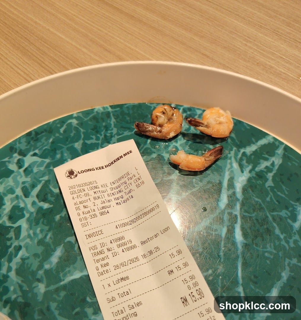 Receipt and Shrimp on Plate