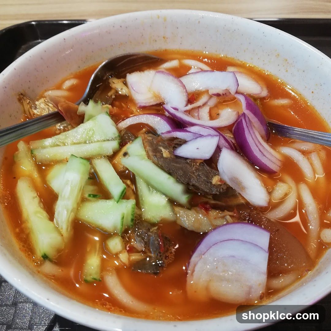 Spicy Noodle Soup with Cucumber and Onions