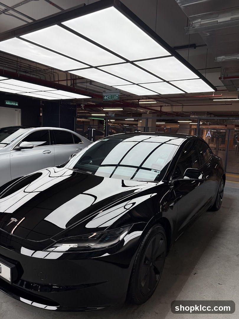 Black Tesla in Parking Garage