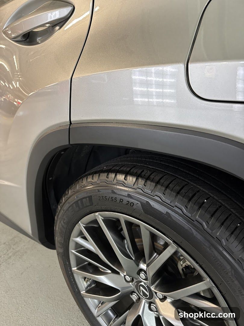 Close-up of a car's rear wheel and fender