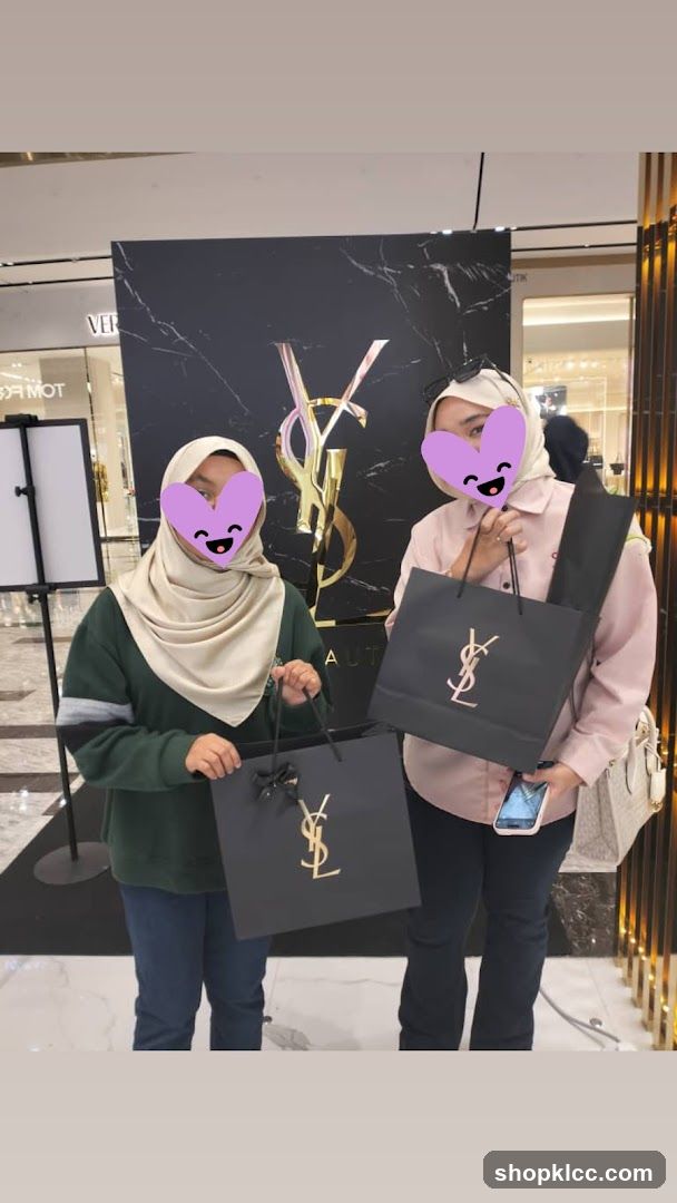 Two people holding shopping bags