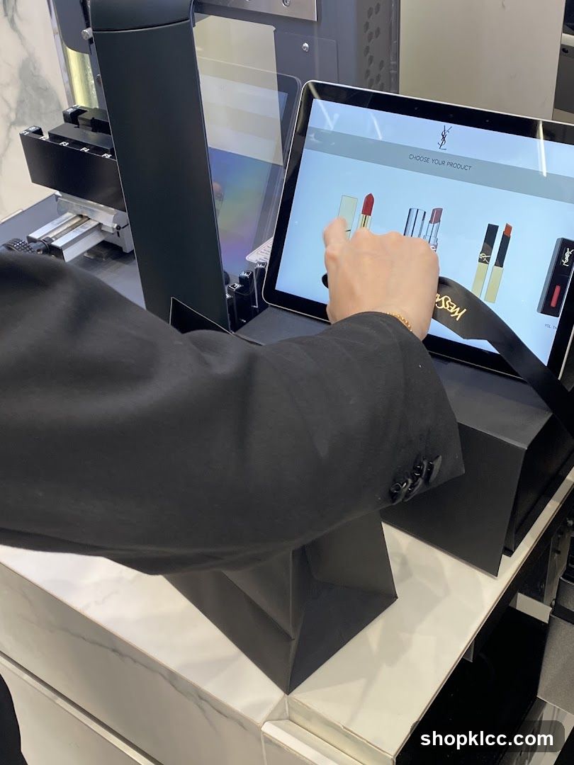 Customer selecting lipstick on a touchscreen