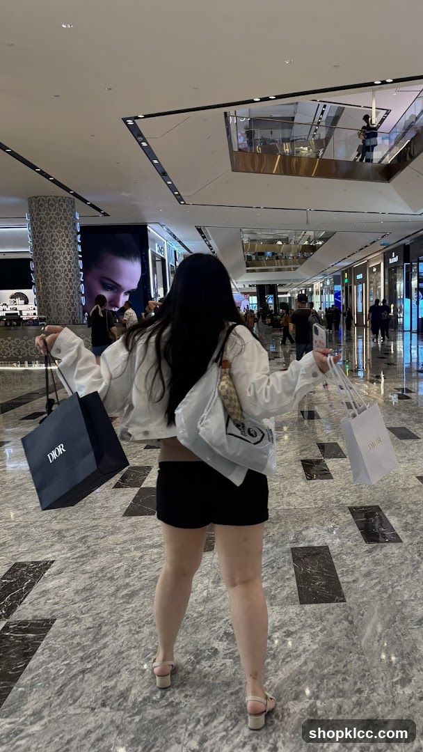 Woman with shopping bags in a mall