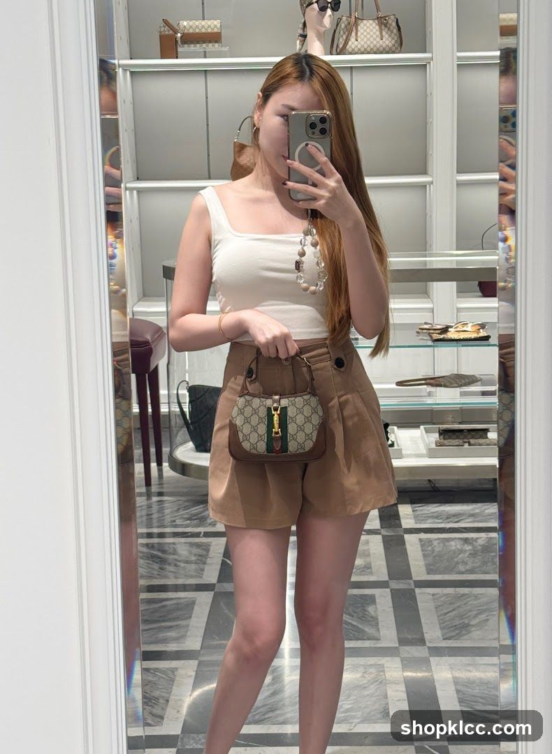 Woman holding a Gucci bag