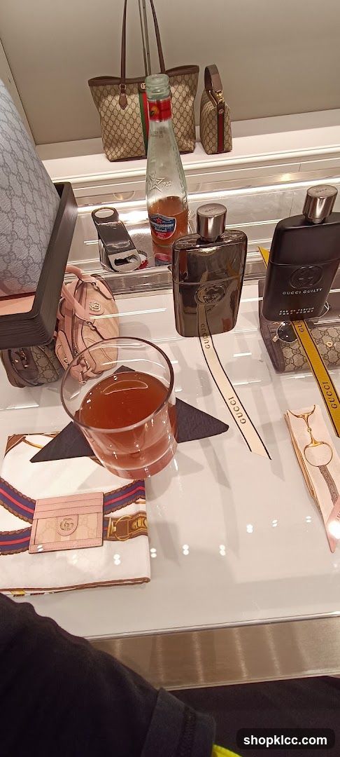 Gucci display with perfume and accessories
