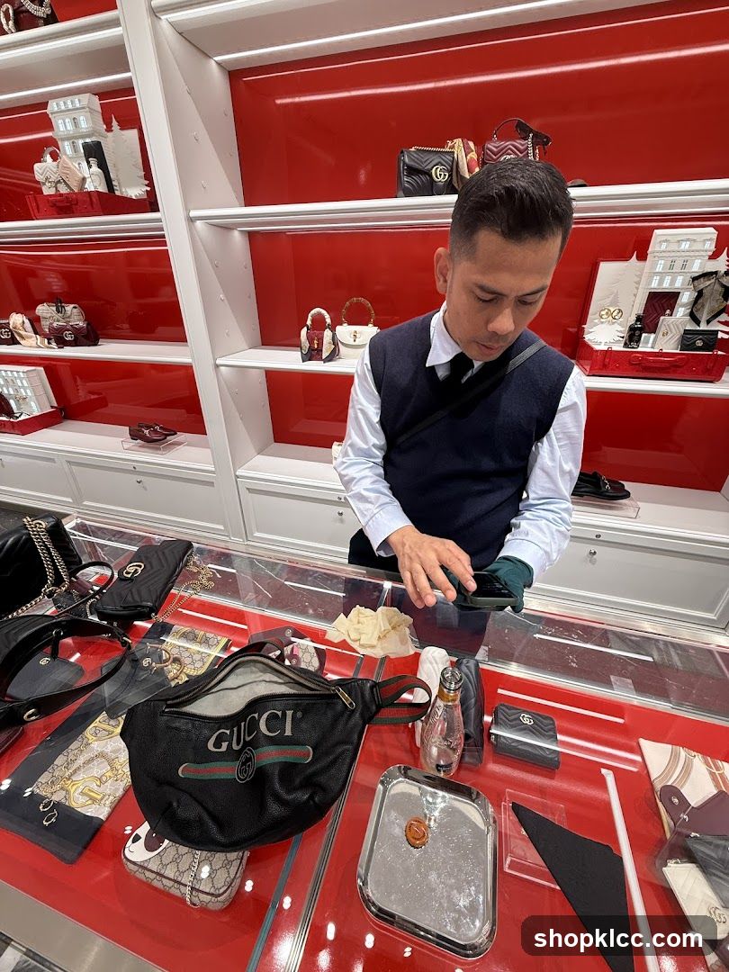 Sales Associate Assisting Customer with Gucci Products