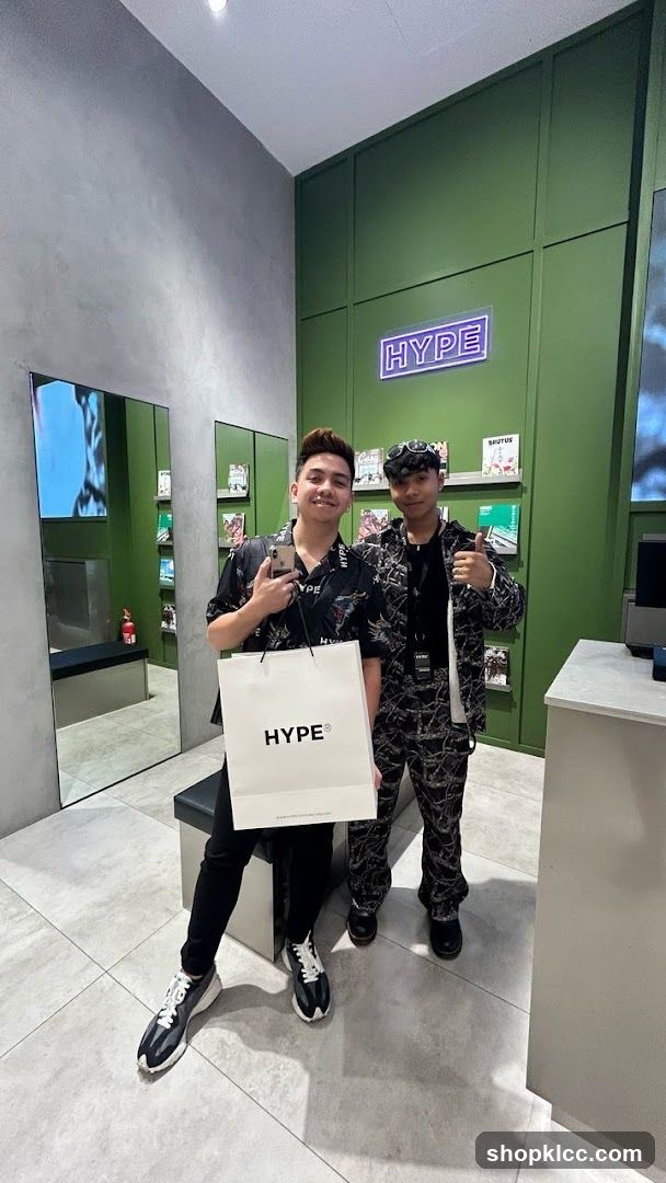 Two people posing in a store