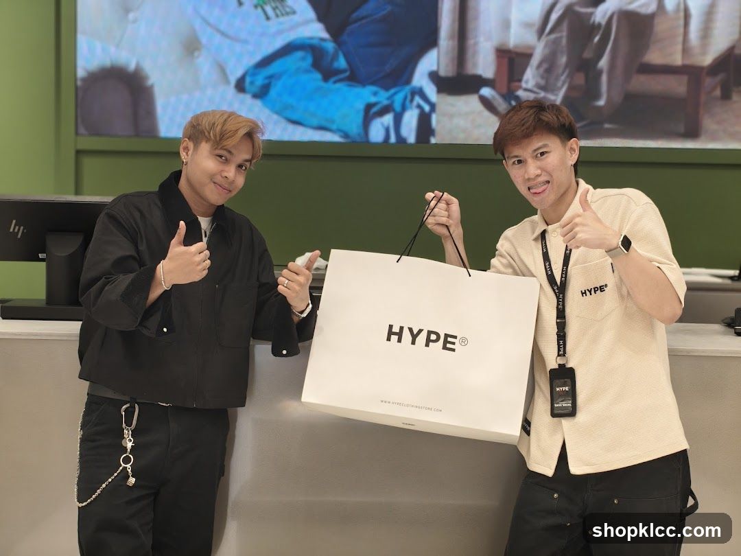 Two men holding a shopping bag