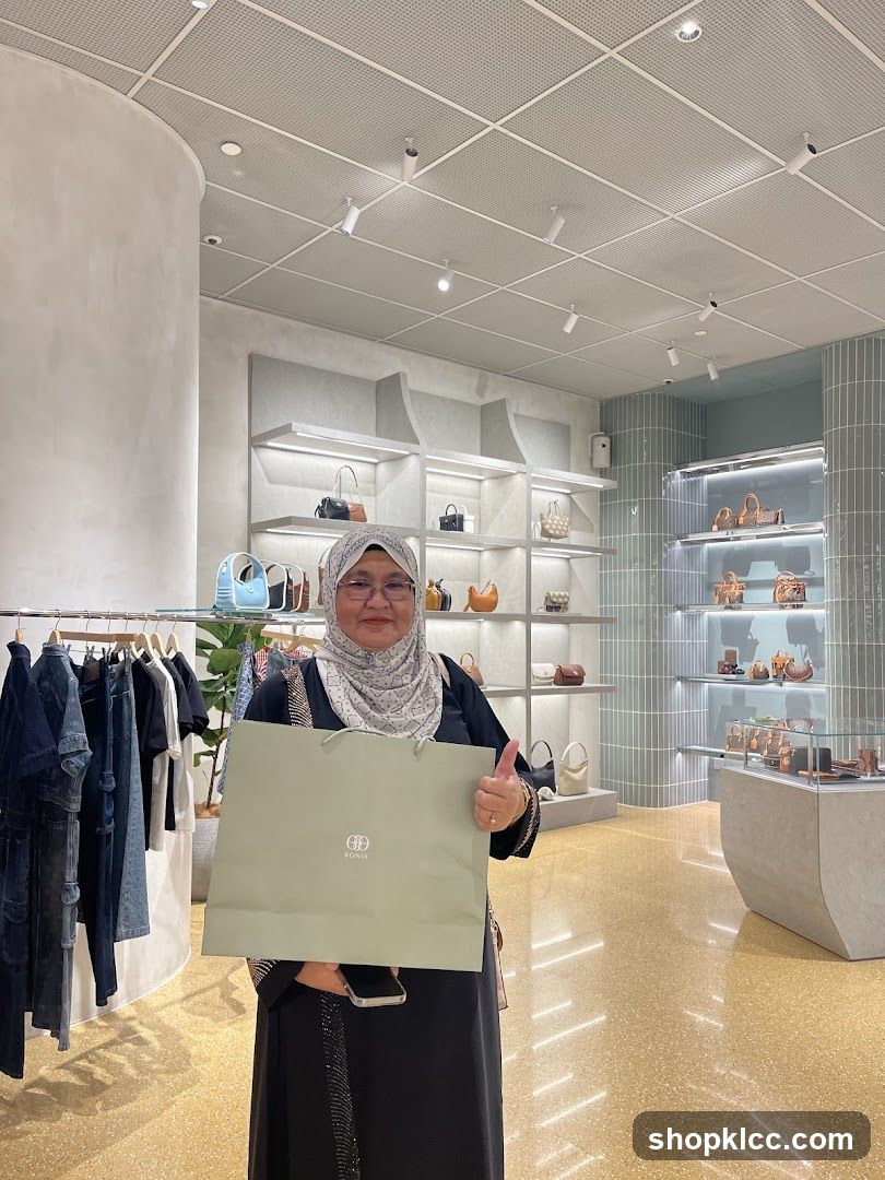 Woman holding a shopping bag in a boutique