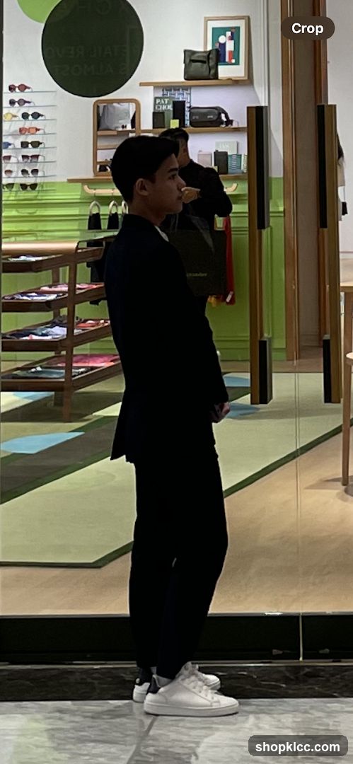Man in a Suit Standing in a Store