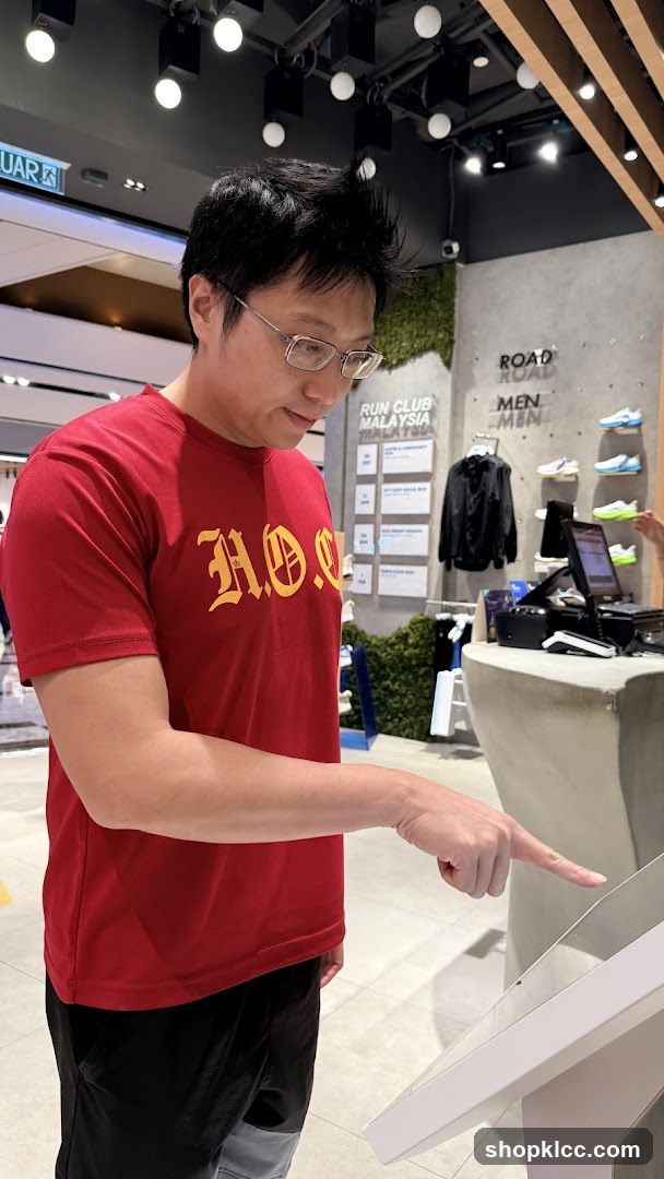 Man Interacting with a Touchscreen Display