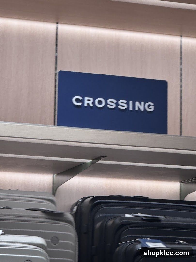 Signage for "CROSSING" above luggage display